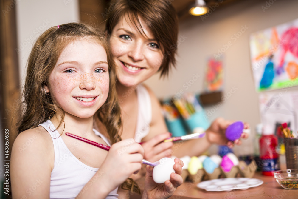 Happy easter A beautiful child girl painting Easter eggs. Happy family preparing for Easter. Happy easter A beautiful child girl painting Easter eggs. Happy family preparing for Easter.