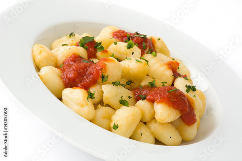 Gnocchi with tomato sauce isolated on white background. 