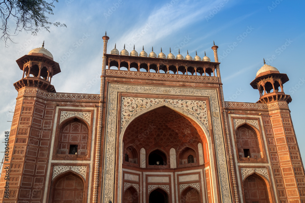 Taj Mahal west gate close up - A beautifully crafted red sandstone structure bearing the heritage of Mughal architecture in India.