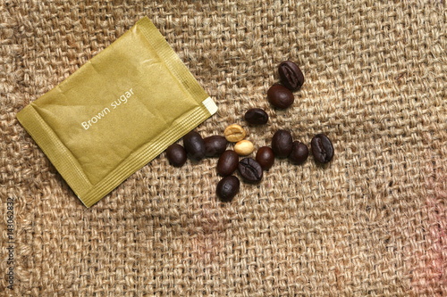 Brown sugar bag put on coffee sack or gunny sack brown color represent texture surface background.