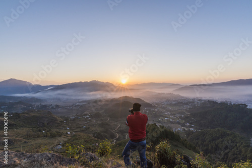 Canvas Print Photographer in action, clicking a beautiful Himalayan Sunrise.