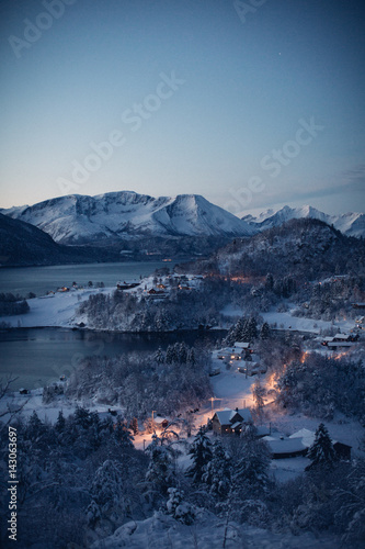 Illuminated snowscape, mountains and lake 