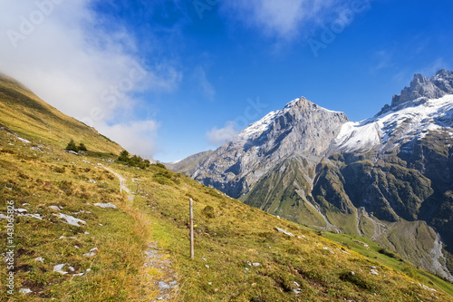 Small mountain hiking path in swiss alps