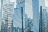 Skyscrapers with glass facade. Modern buildings in business district. Concepts of economics, financial, future