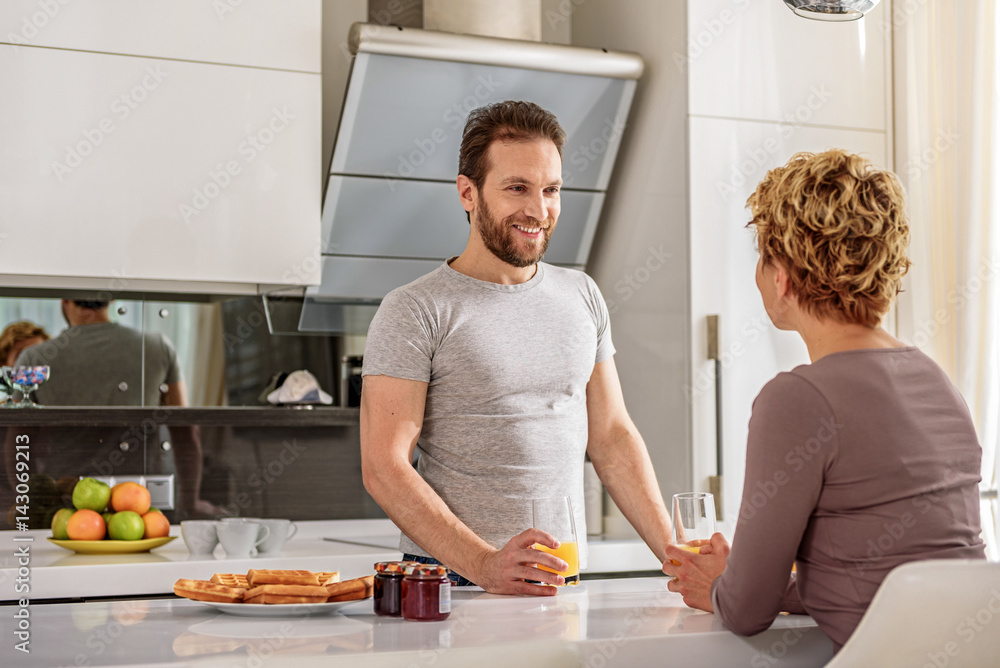 Happy married couple having breakfast at home Happy married couple having breakfast at home