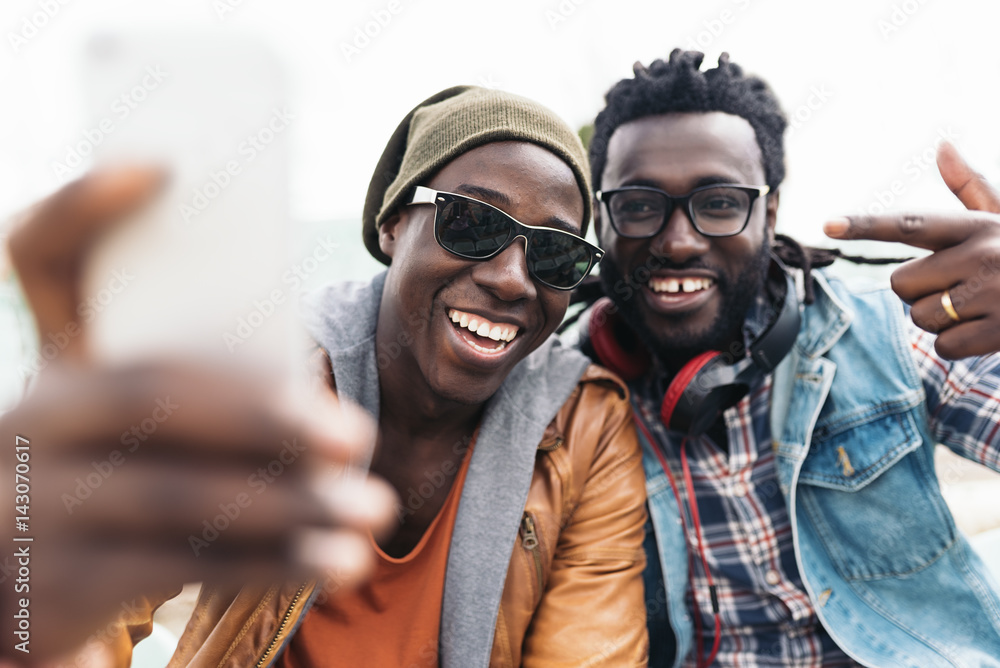 © santypan - Two black race friends having fun.