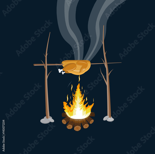Bonfire with grilled chicken. Logs and fire.