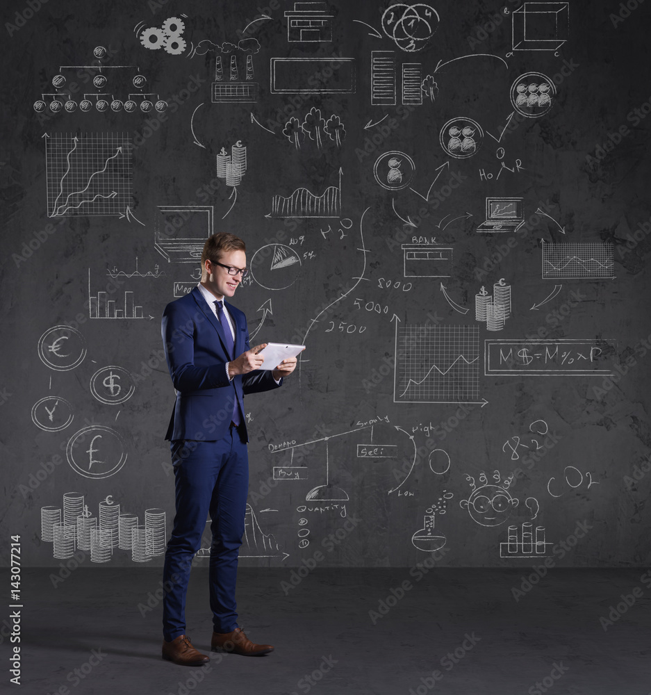 Businessman with computer tablet.  Schematic background. Business and office, concept.