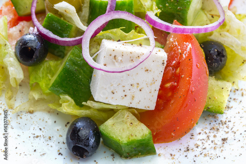 Close-up of salad with tomato, olives with cheese