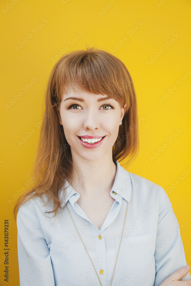 Beautiful young woman on a yellow background Beautiful young woman on a yellow background