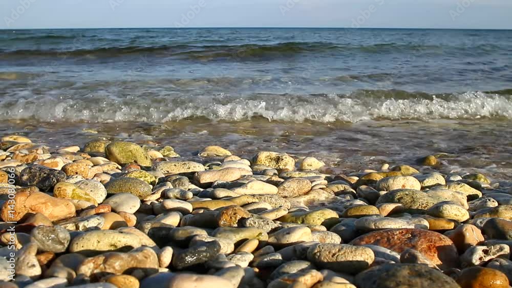 Pebble beach, washed by the waves Pebble beach, washed by the waves