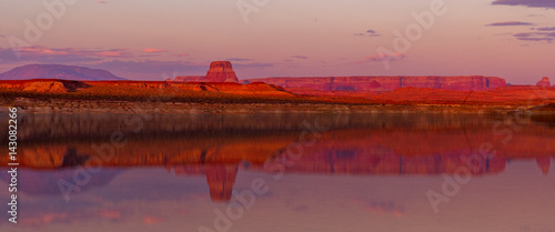 Mountain Cliffs at Sunset with a Lake Reflection