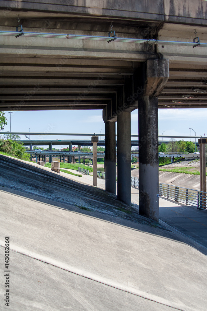 A trail in Buffalo Bayou Park that goes under the bridges. A trail in Buffalo Bayou Park that goes under the bridges.