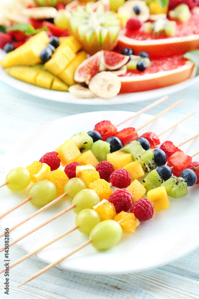 Fresh fruit salad on a white wooden table Fresh fruit salad on a white wooden table
