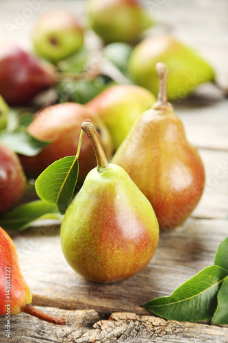 Ripe pears on grey wooden table