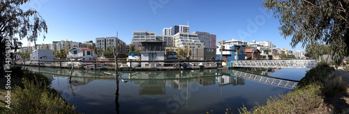 San Francisco cityscape-lagoon, houseboats, skyline and blue sky.
