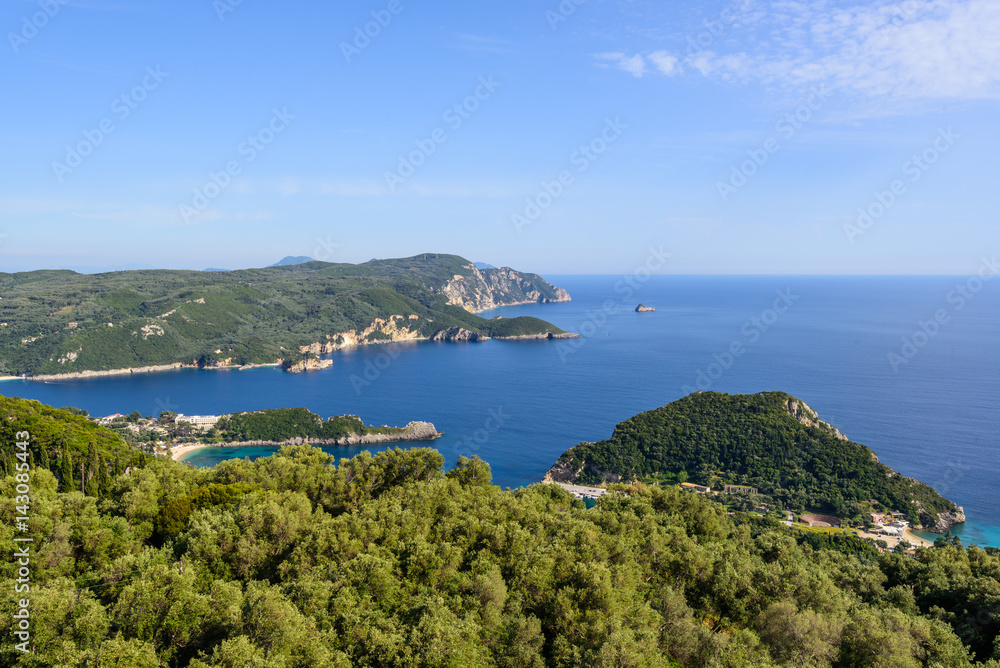 The bay of Palaiokastritsa located on the northwest coast of Corfu with rocky coast and isolated picturesque coves with sandy beaches. A view from above. Greece.