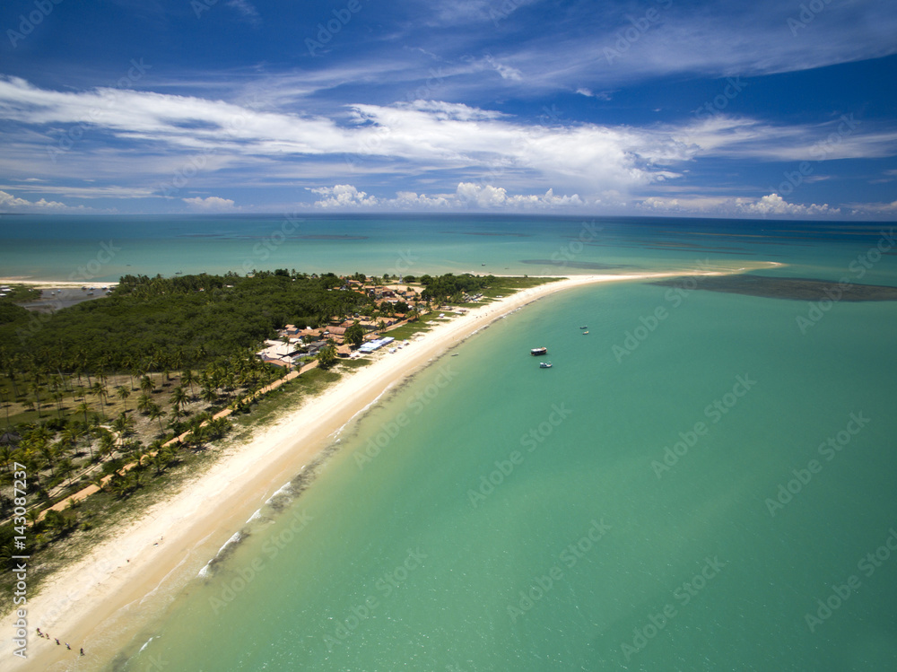 Aerial view Green sea at a brazilian beach coast on a sunny day in Corumbau, Bahia, Brazil. february, 2017.