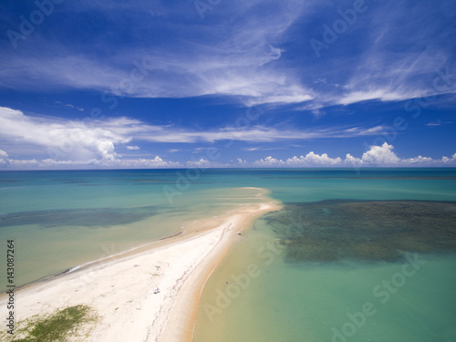 Aerial view Green sea at a brazilian beach coast on a sunny day in Corumbau, Bahia, Brazil. february, 2017. photo