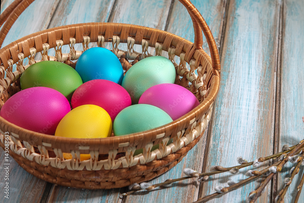 Basket with colourful hand-painted Easter eggs Basket with colourful hand-painted Easter eggs