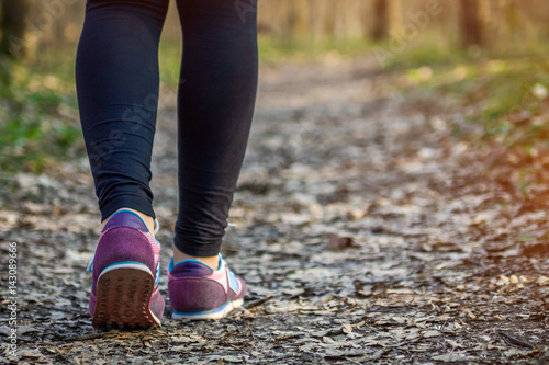 Sporty woman walking in the forest