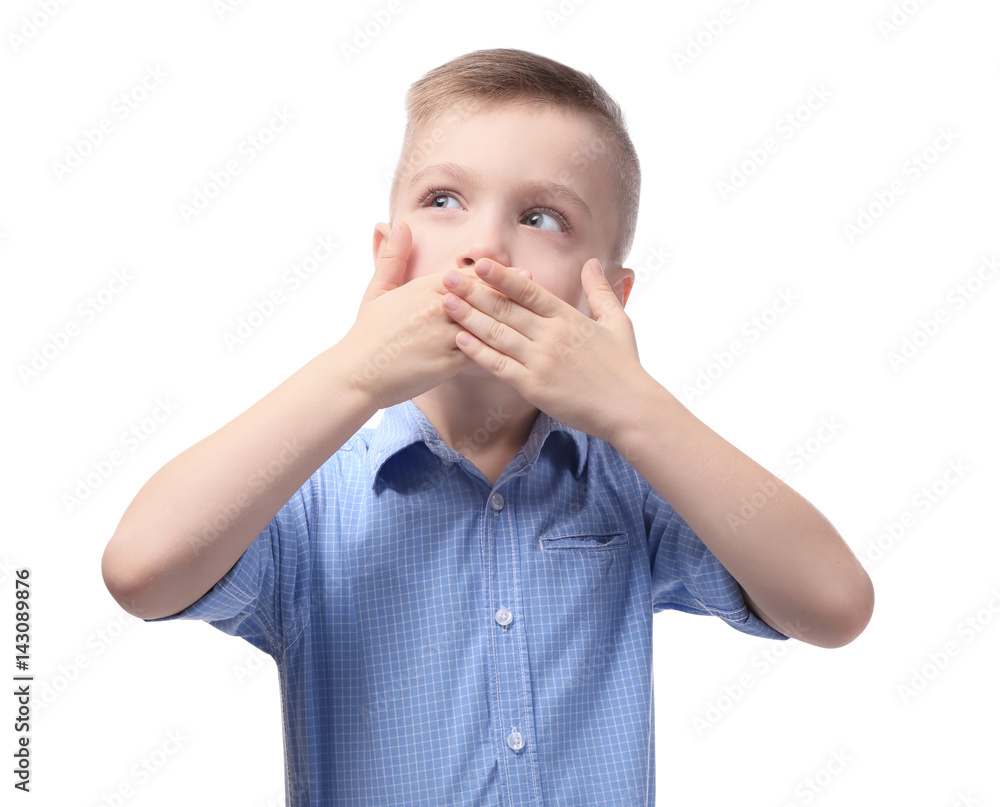 Cute little boy covering mouth with hands, on white background Cute little boy covering mouth with hands, on white background