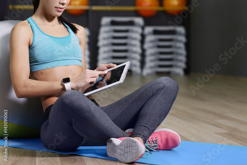 Young woman with tablet com...