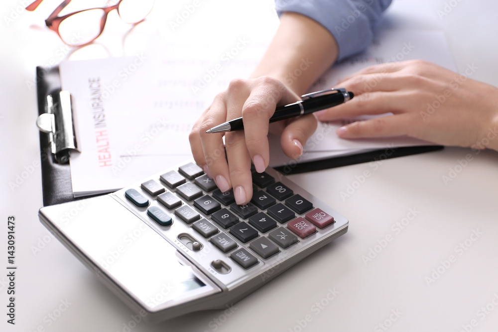 Life planning concept. Hands of insurance agent at workplace Life planning concept. Hands of insurance agent at workplace
