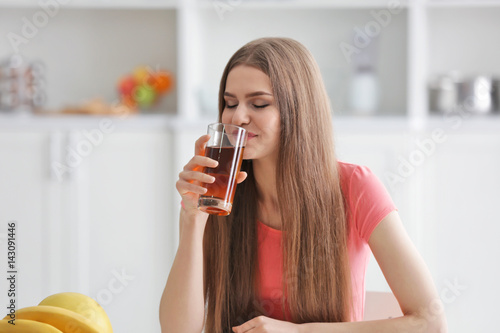 Young woman tasting fresh j...