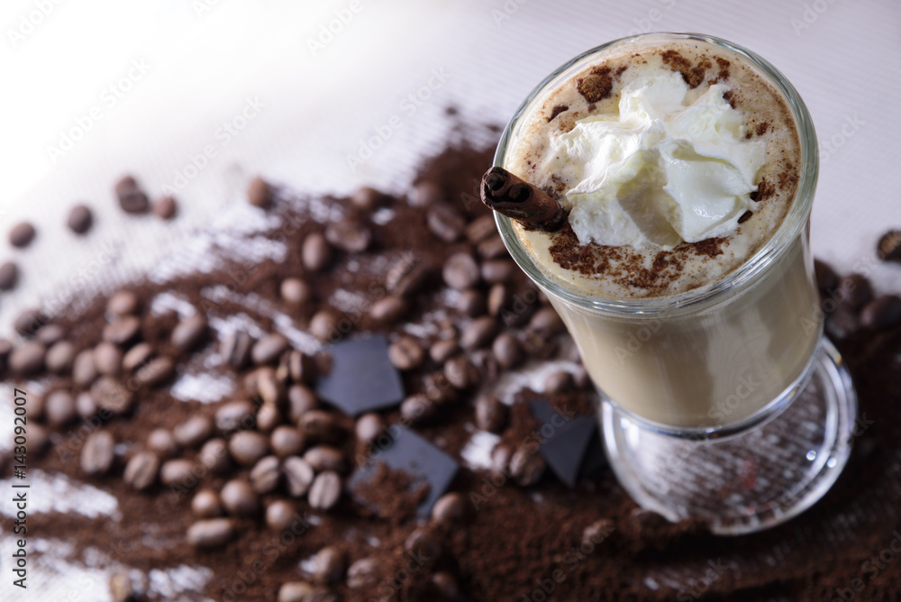 Cappuccino cinnamon, coffee beans and chocolate Cappuccino cinnamon, coffee beans and chocolate