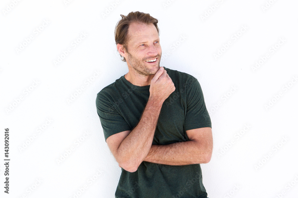 happy man smiling against white wall happy man smiling against white wall