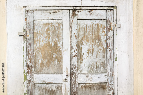 Close up of old wooden door with cracked paint