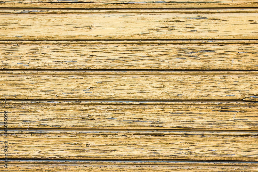 Fototapeta premium Aged wooden wall with peeling paint texture.
