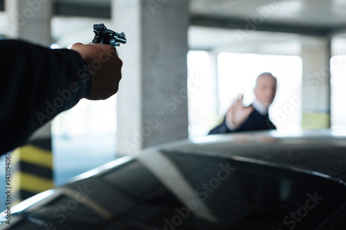Canvas Print Handgun being targeted at a man