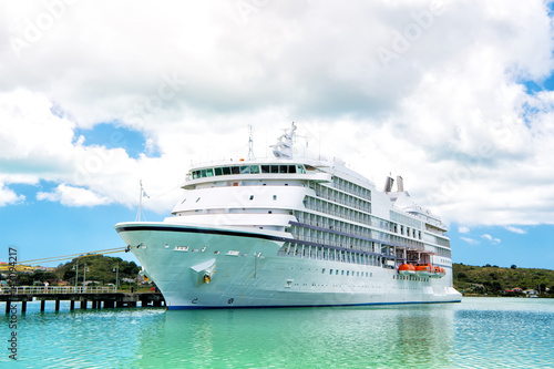 big cruise ship, white luxury yacht in sea port, Antigua © be free