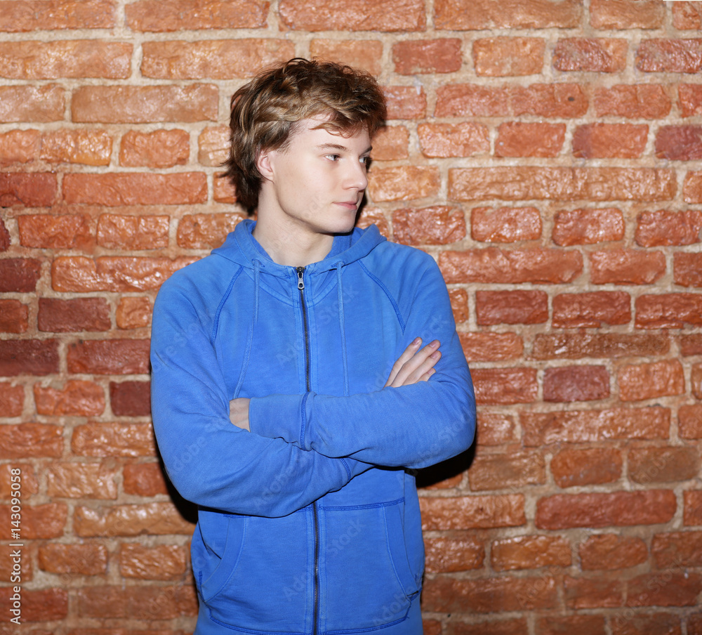 Attractive teenage boy in urban background Attractive teenage boy in urban background