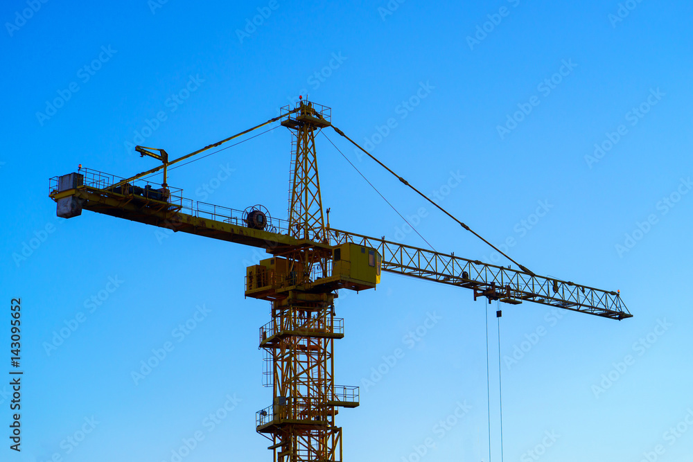 construction crane on the blue sky background