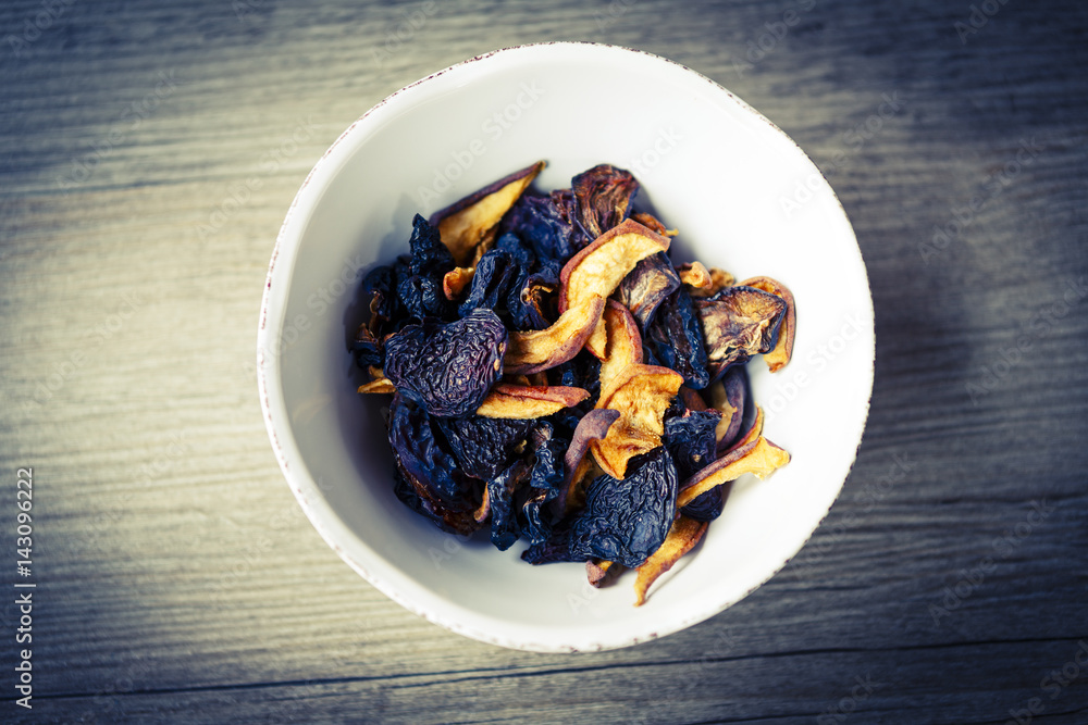 dry fruit in white bowl on wooden floor or table dry fruit in white bowl on wooden floor or table