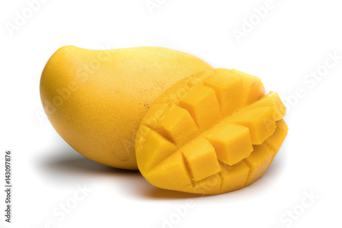 Ripe mango with a slice isolated on white background