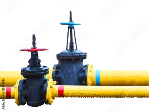 Old yellow gas pipes and valves isolated on white background