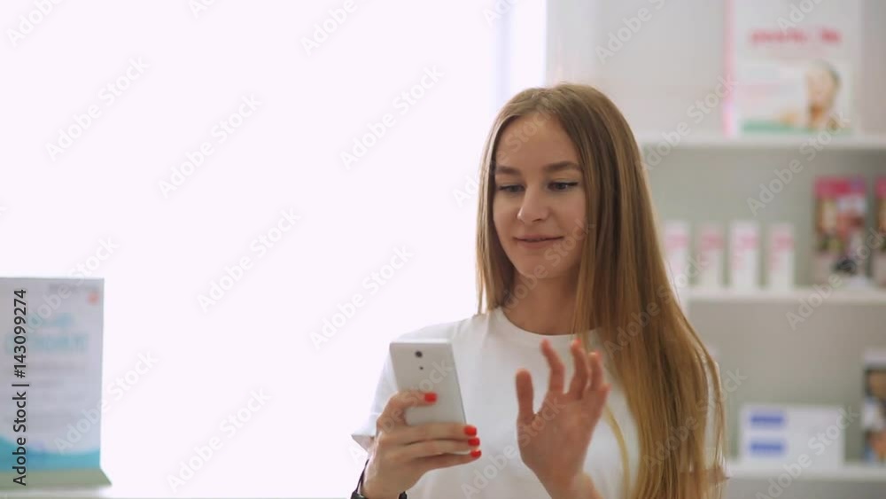 Doctor in a dental clinic takes pictures of a patient on a smartphone