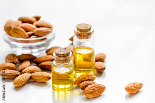 cosmetic set with almond oil on table background