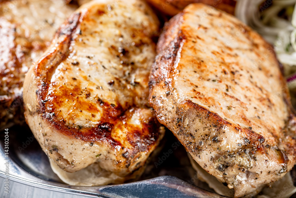 Juicy grilled meat pieces close up with selective focus Juicy grilled meat pieces close up with selective focus