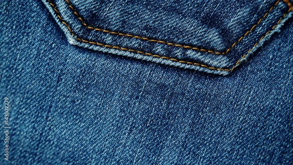closeup detail of blue denim jeans, texture background 4K ProRes HQ codec closeup detail of blue denim jeans, texture background 4K ProRes HQ codec