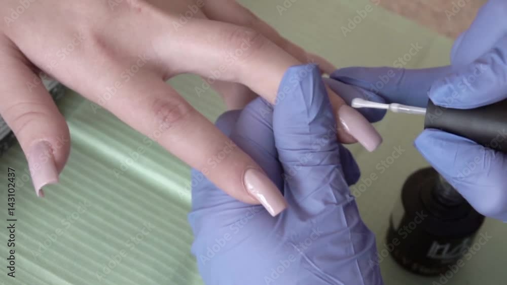 Manicure process in beauty salon Manicure process in beauty salon