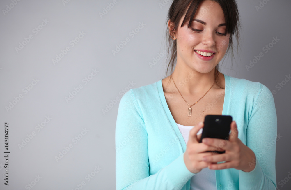 Woman using and reading a smart phone Woman using and reading a smart phone