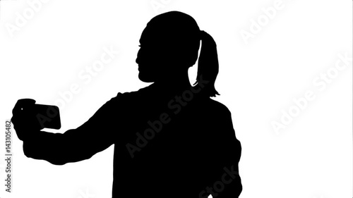 Silhouette Businesswoman taking funny selfie with phone.