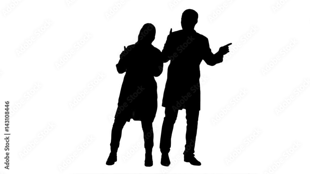 Silhouette Young doctors in a good mood dancing and singing songs. Silhouette Young doctors in a good mood dancing and singing songs.