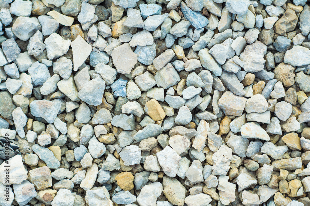 Background of many small stones of different colors, gravel or crushed stone close-up texture Background of many small stones of different colors, gravel or crushed stone close-up texture