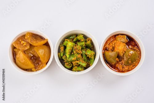 Photography Group photograph of indian pickles like mango pickle , lemon pickle and green ch